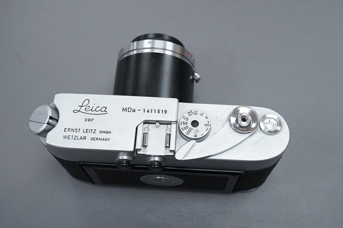 A Leica M Series MDa camera, with a Leitz 0.32:1 lens, the body stamped ‘1411519’